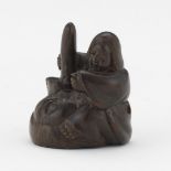 Japanese Rosewood Signed Netsuke of a Man Sitting on a Qilin