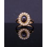 AN ANTIQUE SEED PEARL AND GARNET CLUSTER RING