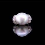 AN NATURAL PEARL AND DIAMOND RING