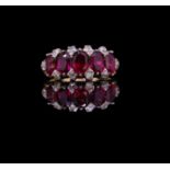 ANTIQUE FIVE STONE RUBY RING WITH DIAMOND POINTS