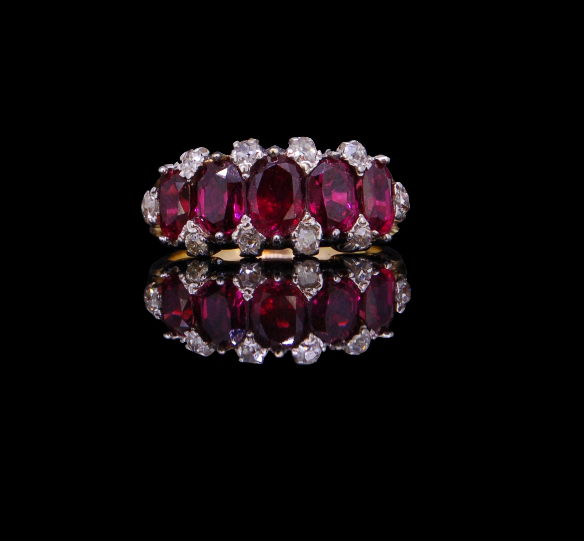 ANTIQUE FIVE STONE RUBY RING WITH DIAMOND POINTS