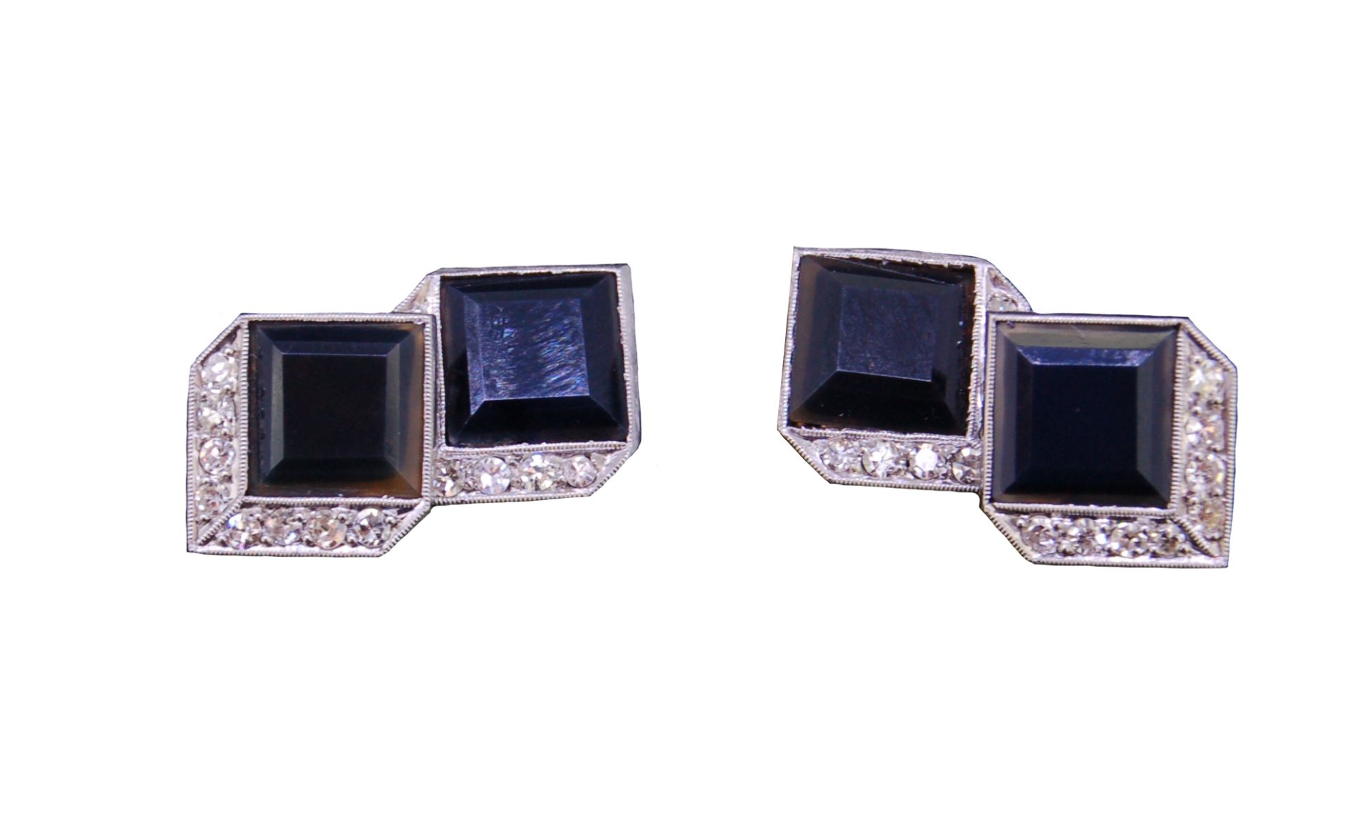 A PAIR OF ART DECO ONYX AND DIAMOND CUFFLINKS,