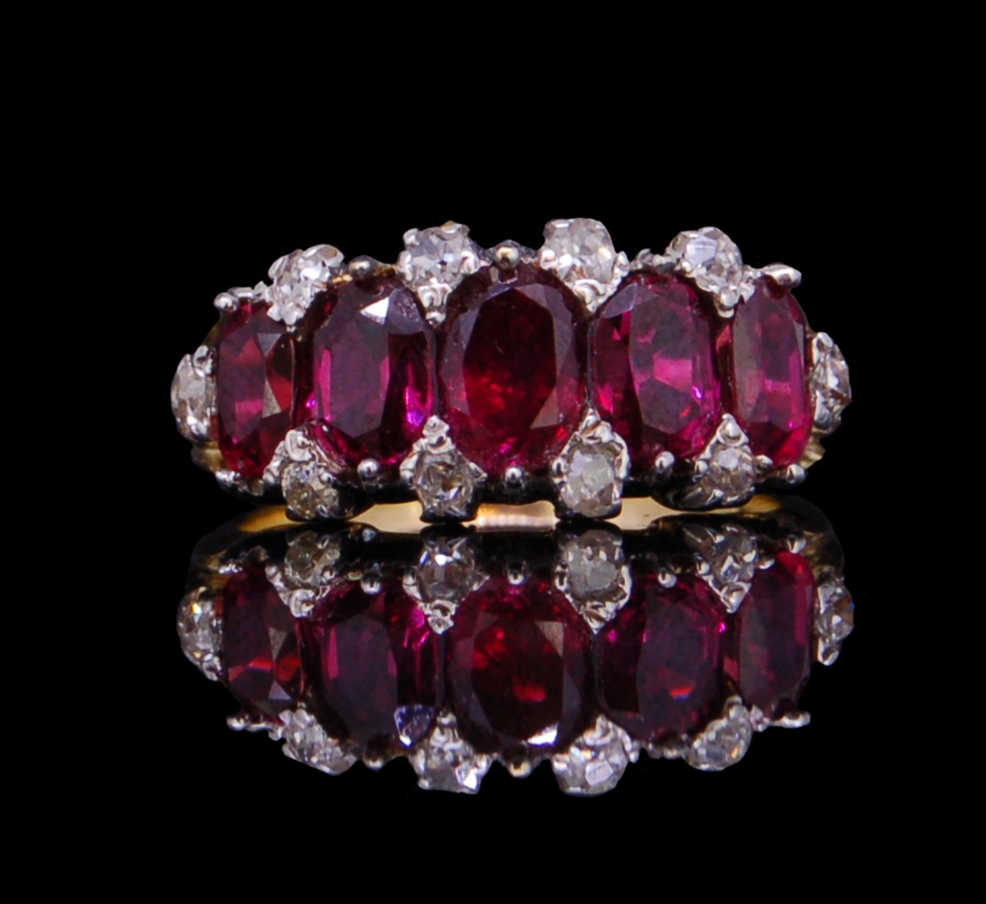ANTIQUE FIVE STONE RUBY RING WITH DIAMOND POINTS