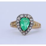 ANTIQUE EMERALD AND DIAMOND CLUSTER RING