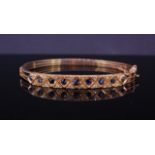 A HINGED SAPPHIRE AND DIAMOND BANGLE