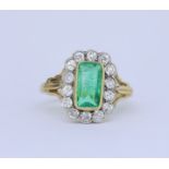 ANTIQUE EMERALD AND DIAMOND CLUSTER RING