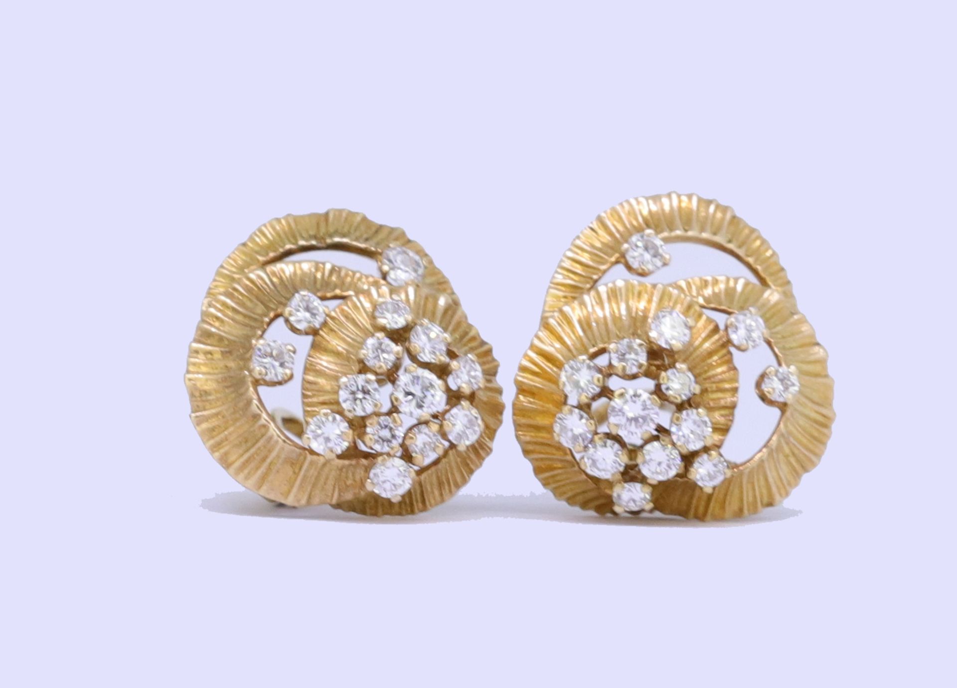 KUTCHINSKY, PAIR OF SCROLLING DIAMOND EARRINGS