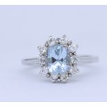 AQUAMARINE AND DIAMOND CLUSTER RING