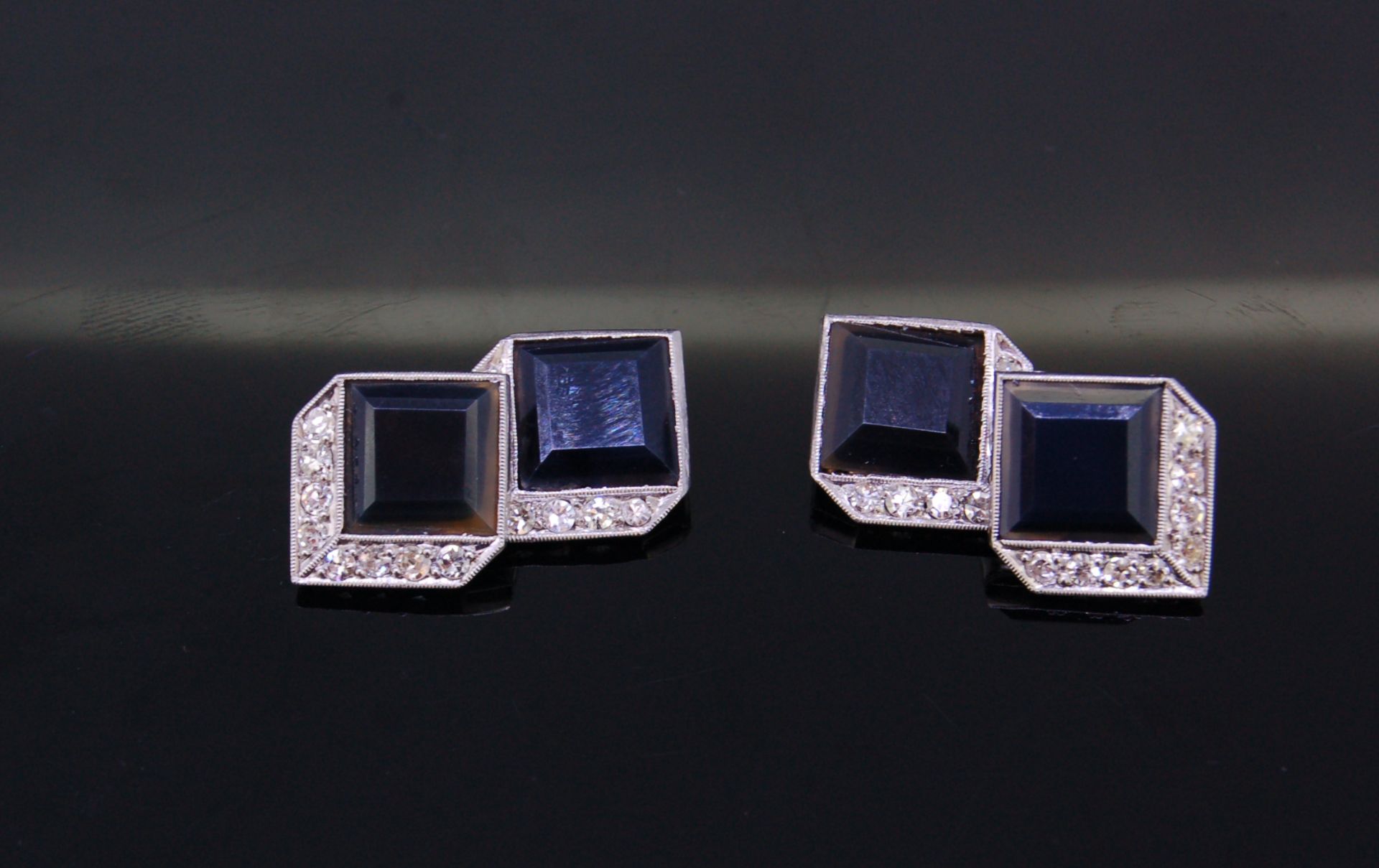 A PAIR OF ART DECO ONYX AND DIAMOND CUFFLINKS