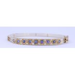 A HINGED SAPPHIRE AND DIAMOND BANGLE