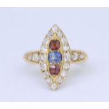 SAPPHIRE, GARNET AND DIAMOND RING