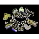 A 9-CT GOLD CHARM BRACELET