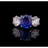 IMPORTANT 4.17 CT BLUE SAPPHIRE AND DIAMOND 3-STONE RING