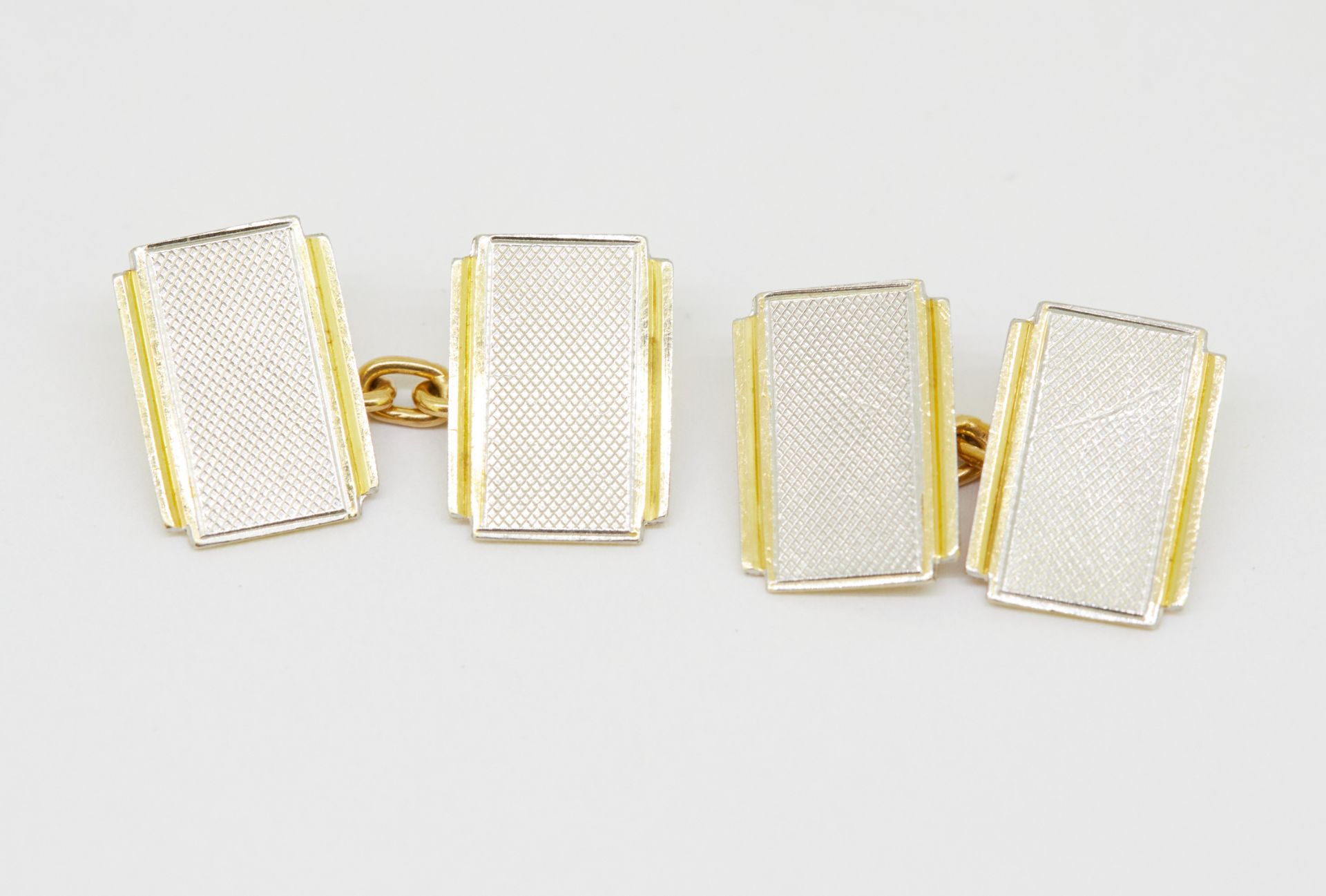 PAIR OF 18-KT GOLD AND PLATINUM CUFFLINKS