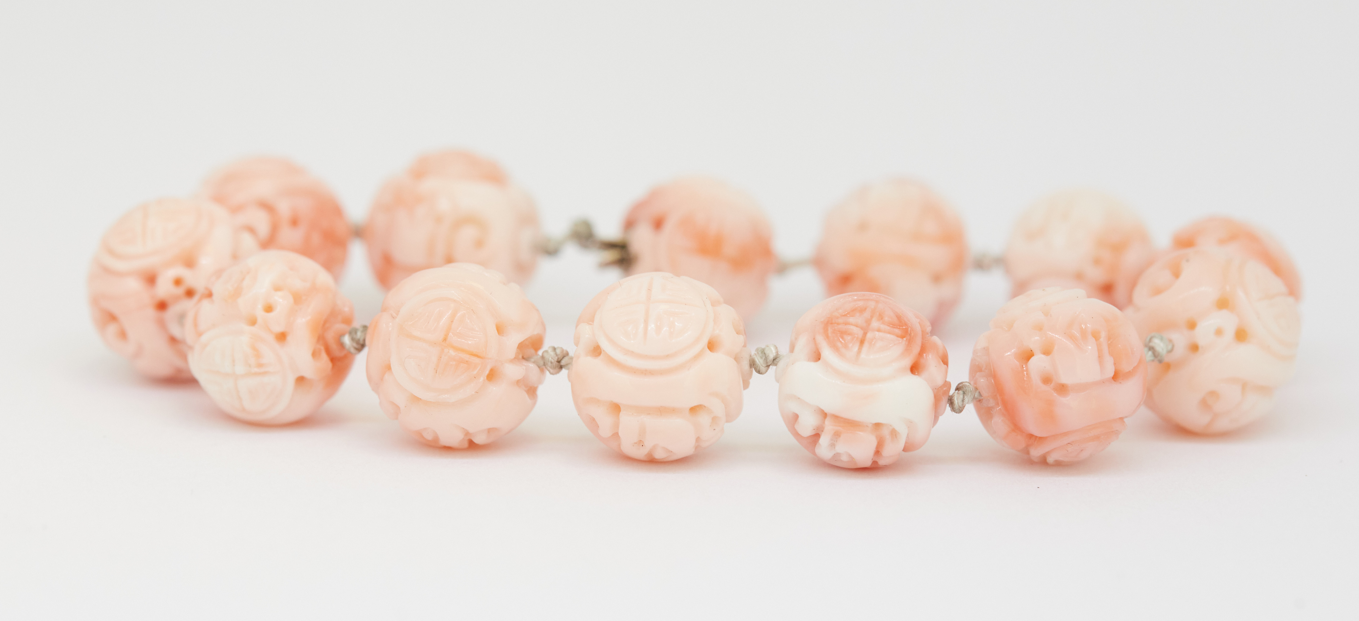 CHINESE CARVED CORAL BEAD BRACELET