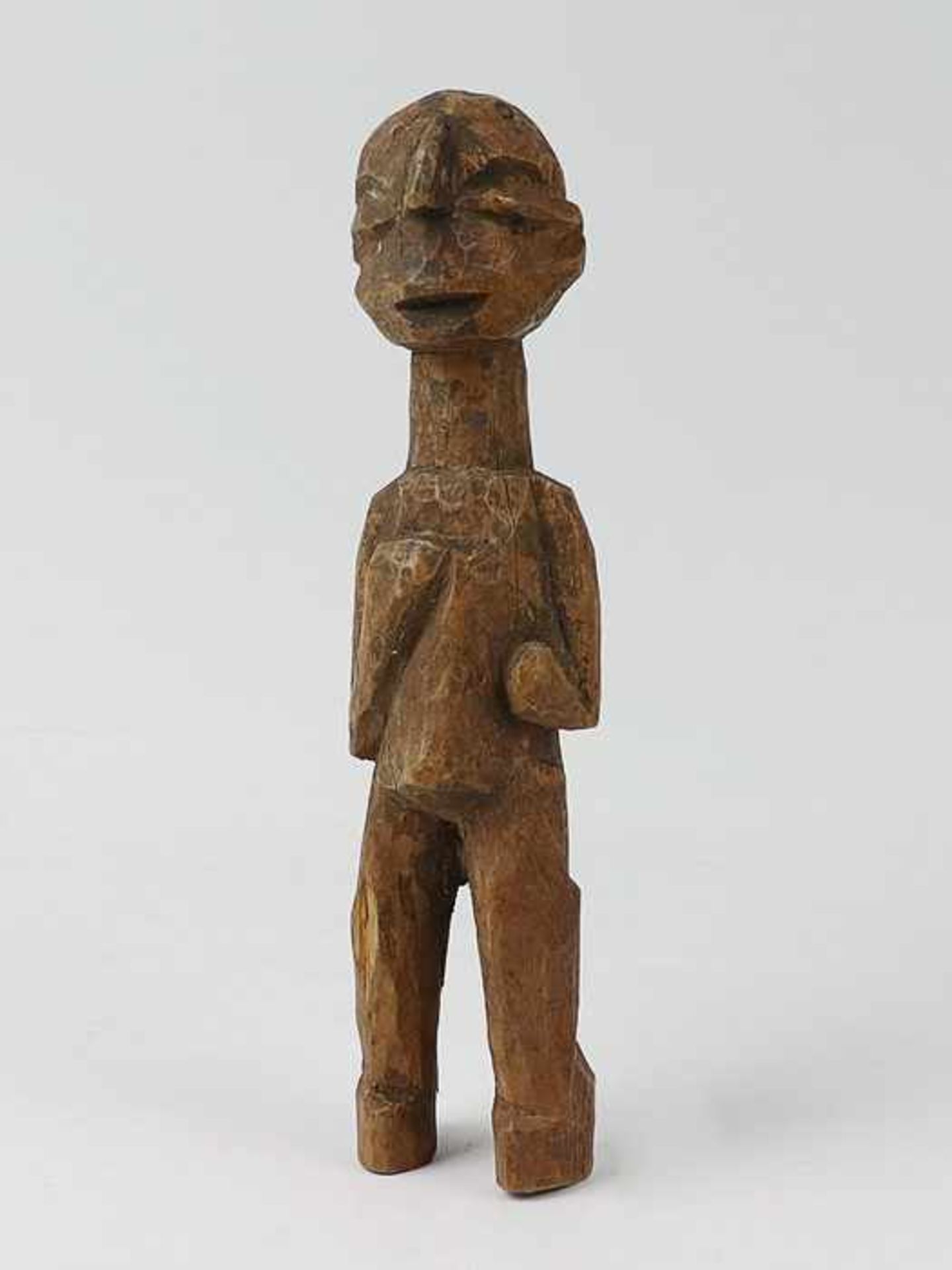 Holzfigur20.Jh., wohl Afrika, vollplastische Holzschnitzerei, stilisierte menschliche Figur m.