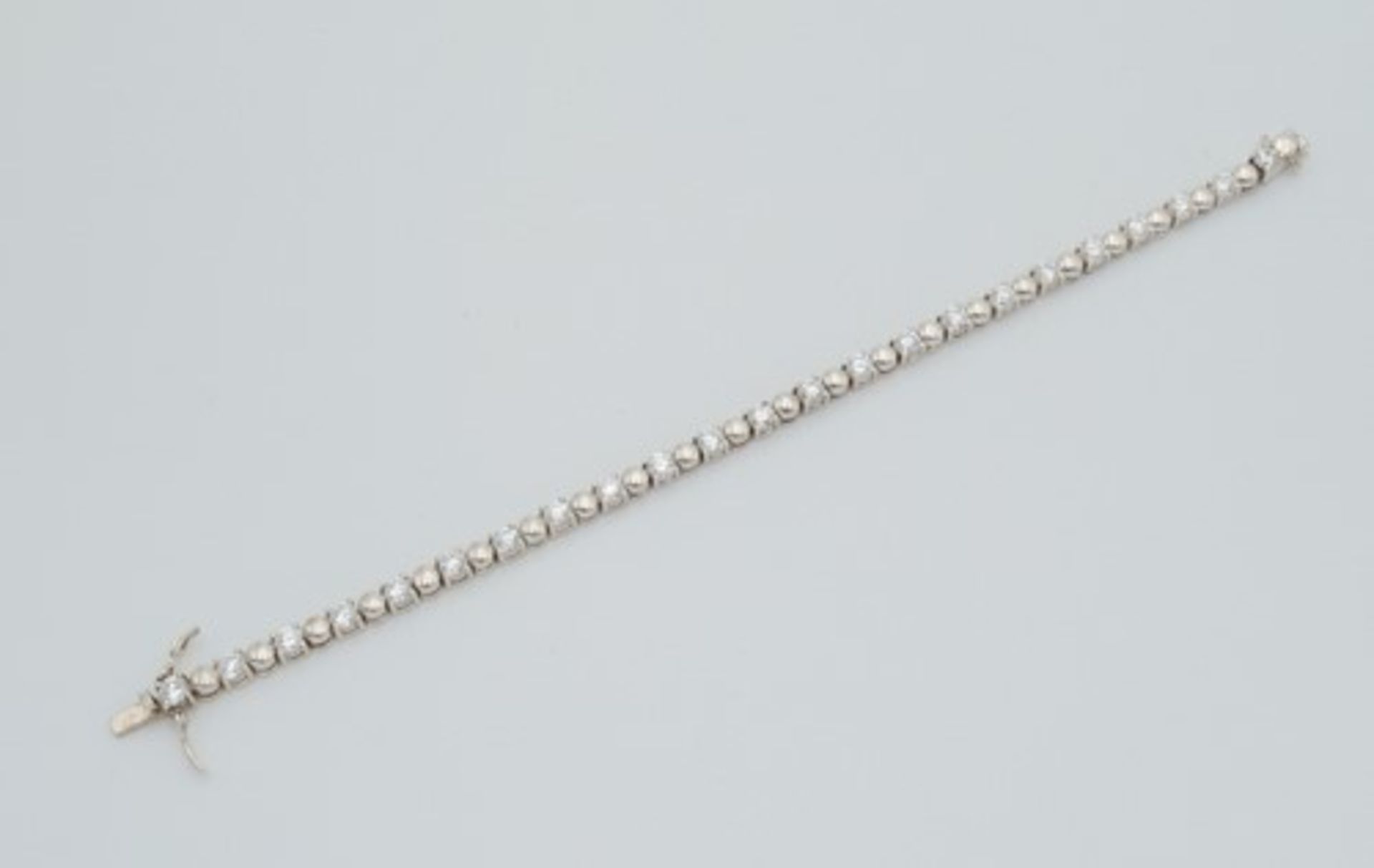 ArmbandSi 925, Krappenfassungen besetzt mit farblosen Schmucksteinen, an kugelförmigen