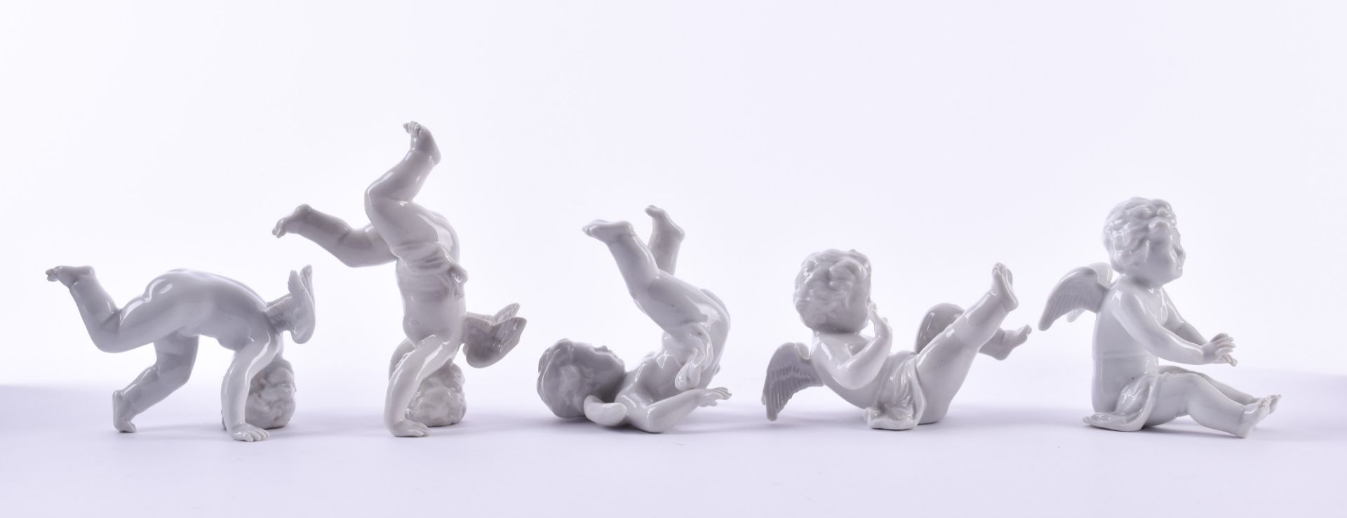 Porzellanfiguren, 20th centurywhite porcelain, the somersault in 5 phases, marked, height: from 5.