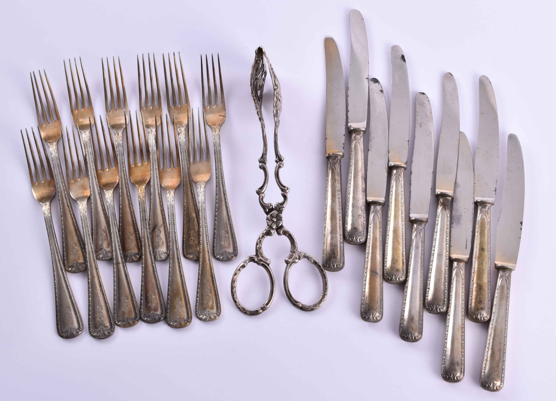 A bundle of silver cutlerymainly 800/000 silver, with fruit knives, fruit forks 1 pastry pincer,