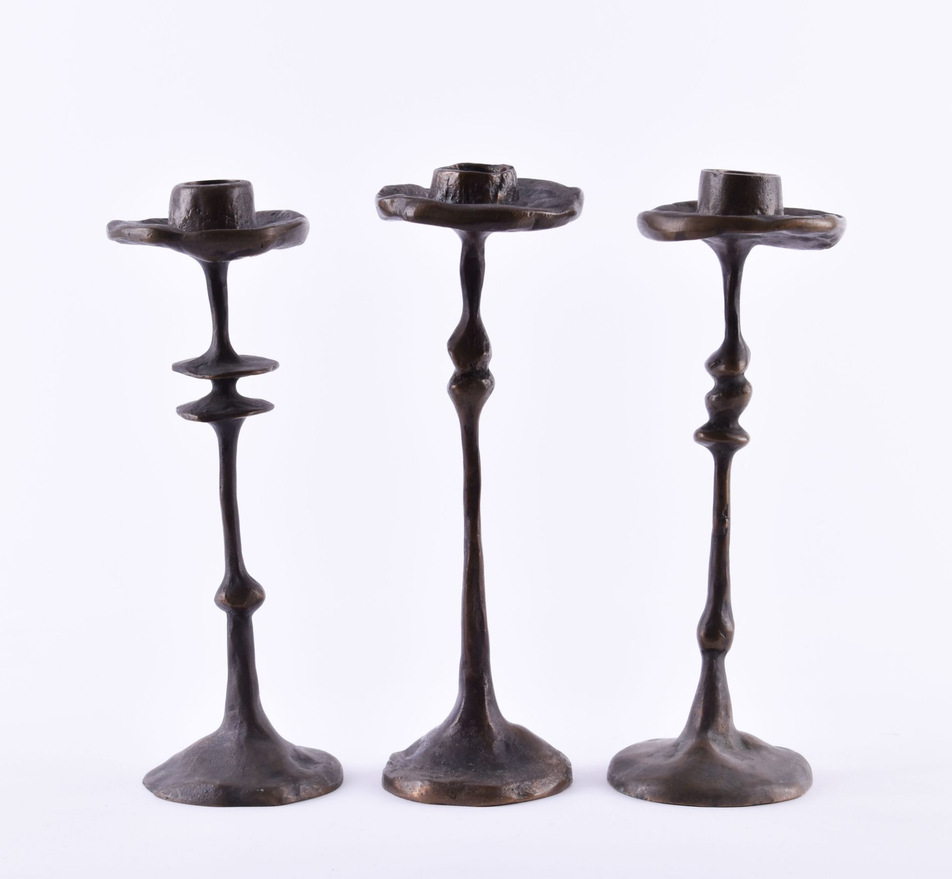 3 bronze candle holderseach signed and dated, 1980 / 81, height: each 25 cm3