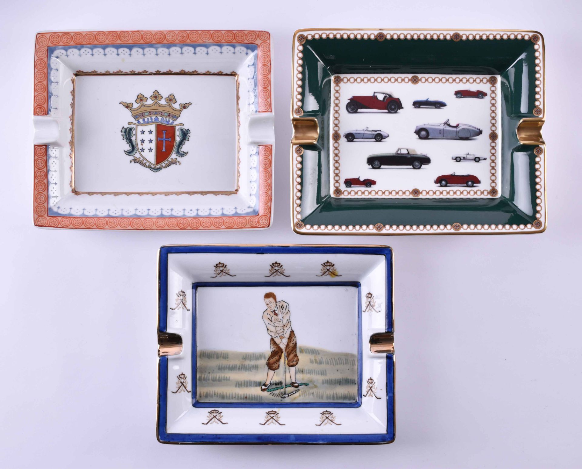 3 ashtraysvarious manufactories, motif cars, golf and coat of arms, from 20 cm x 16 cm to 18.5 cm