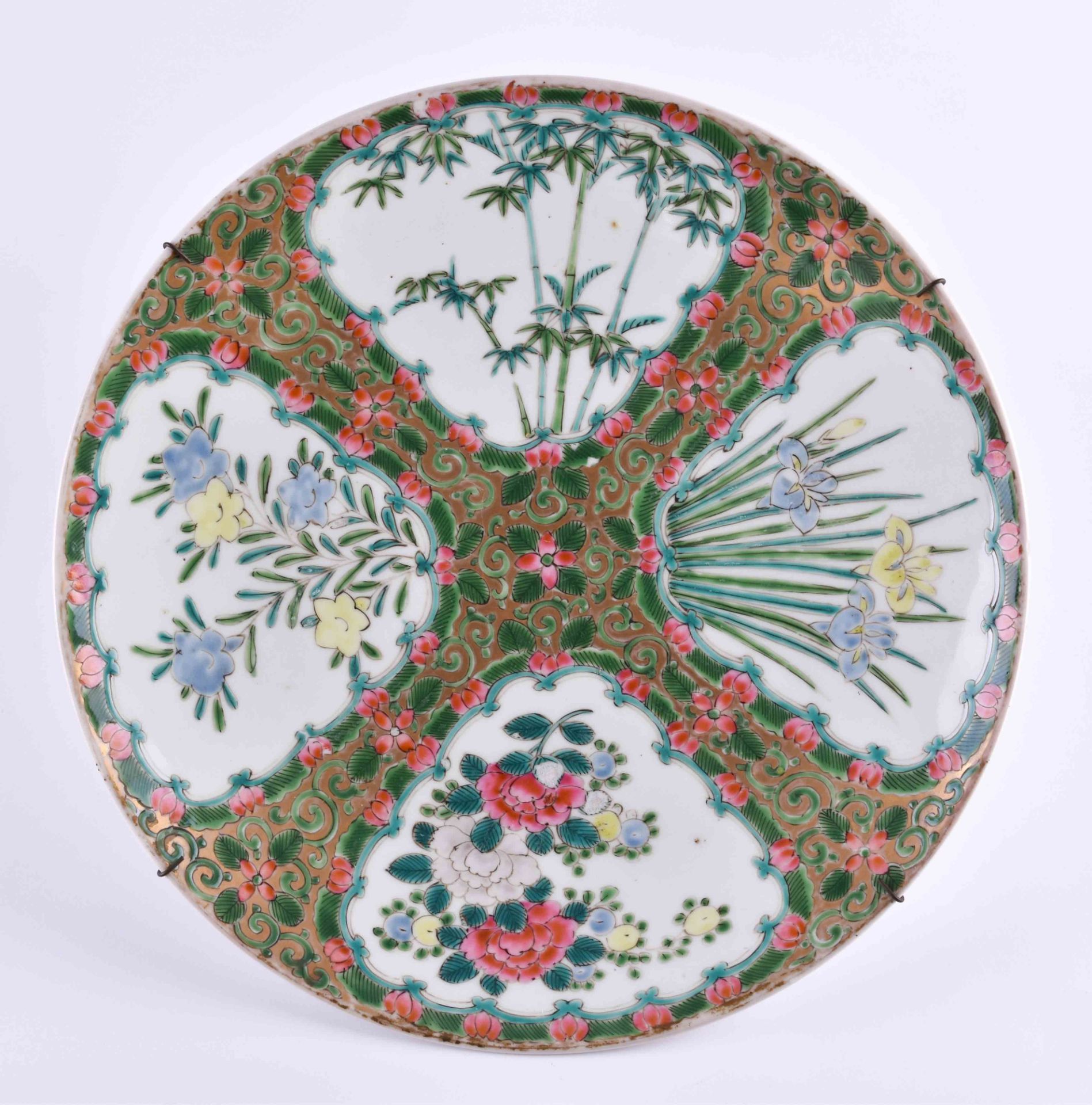 China Qing Dynasty wall platecolored and gold painted with floral decor, under the bottom with