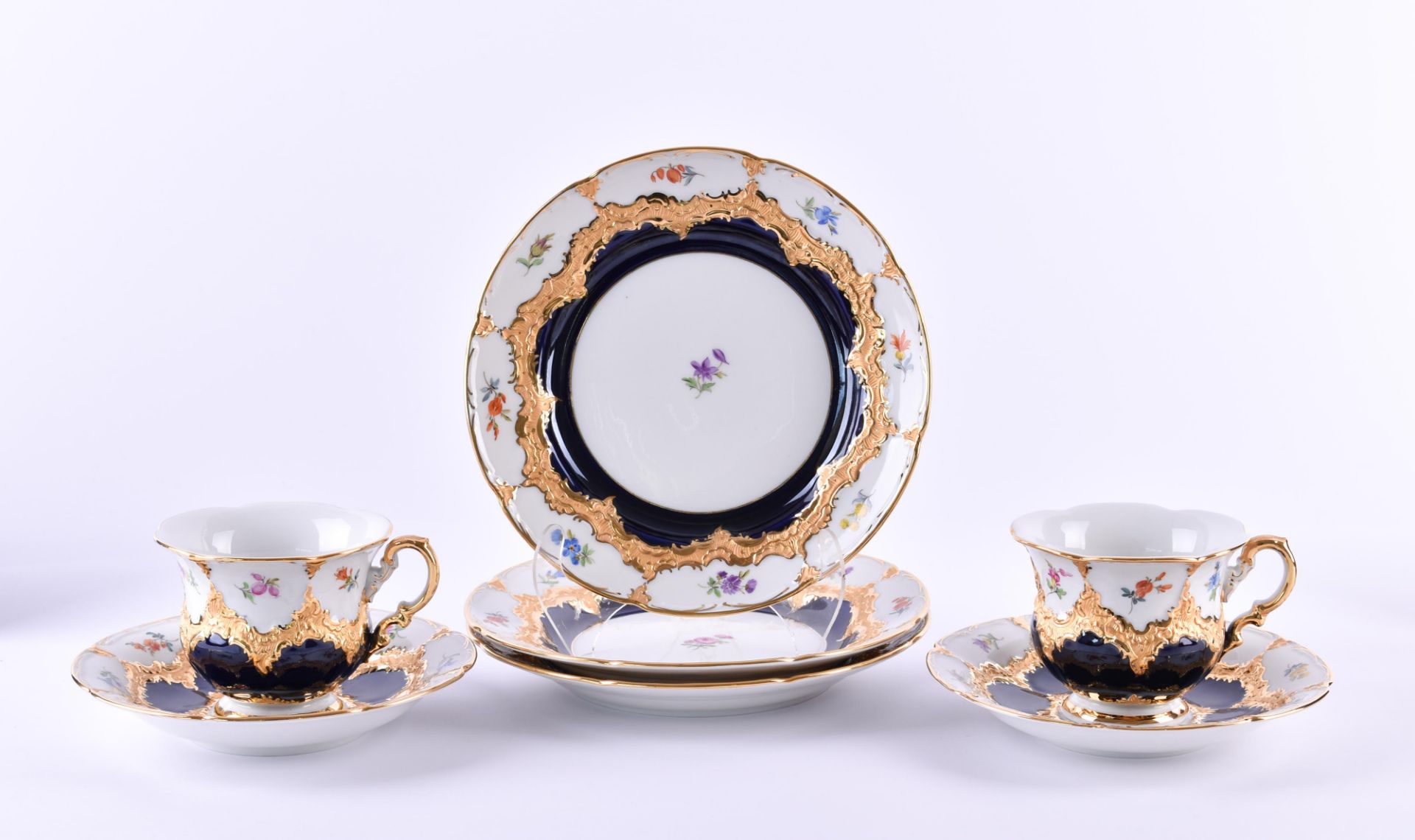A group of Meissen7 pieces, polychrome painted, richly gilded, baroque with scattered flowers, Model