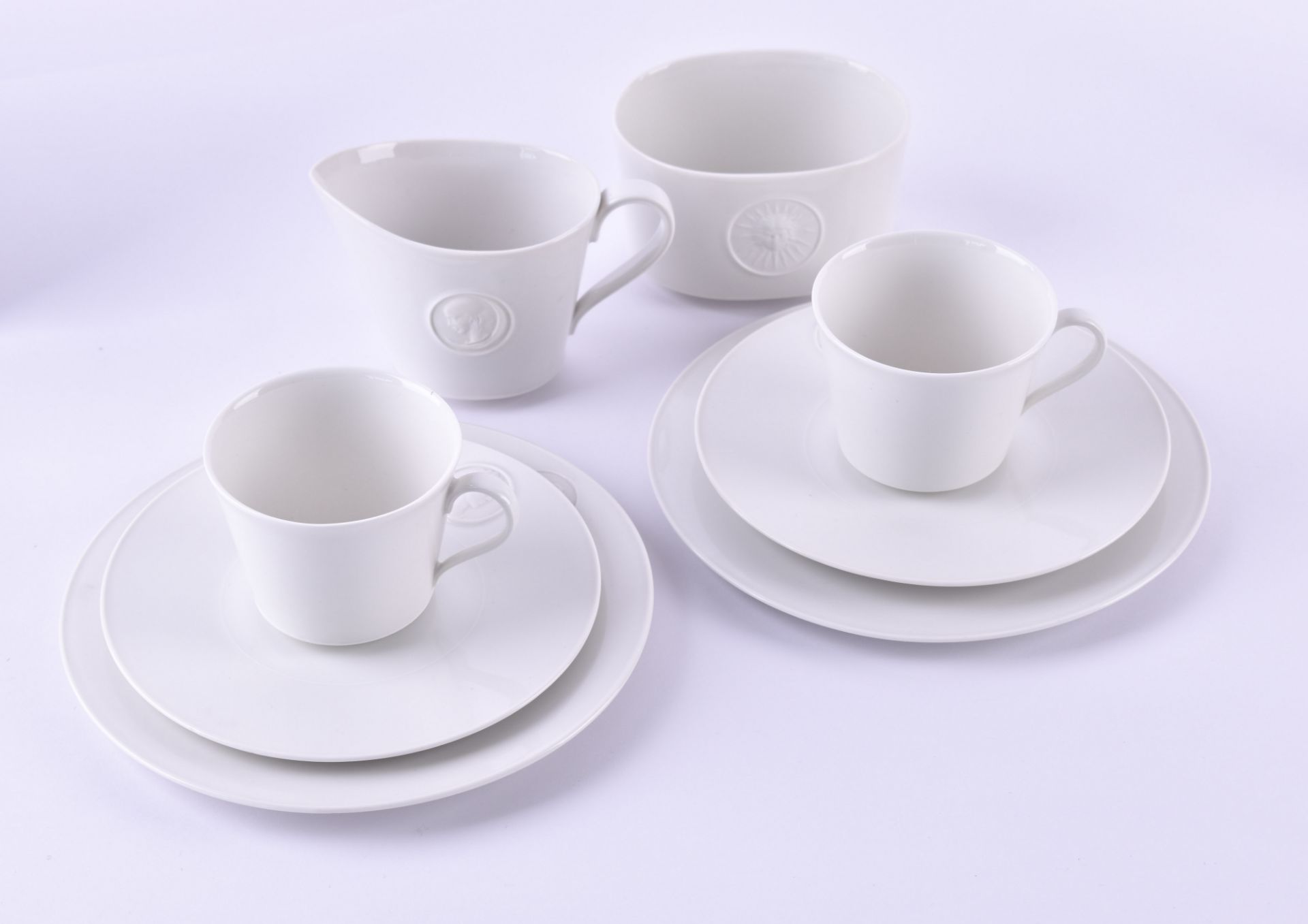 A groupe of KPM Arkadia2 cake plates, 2 cups, 2 saucers, 1 sugar bowl, 1 creamer, blue scepter