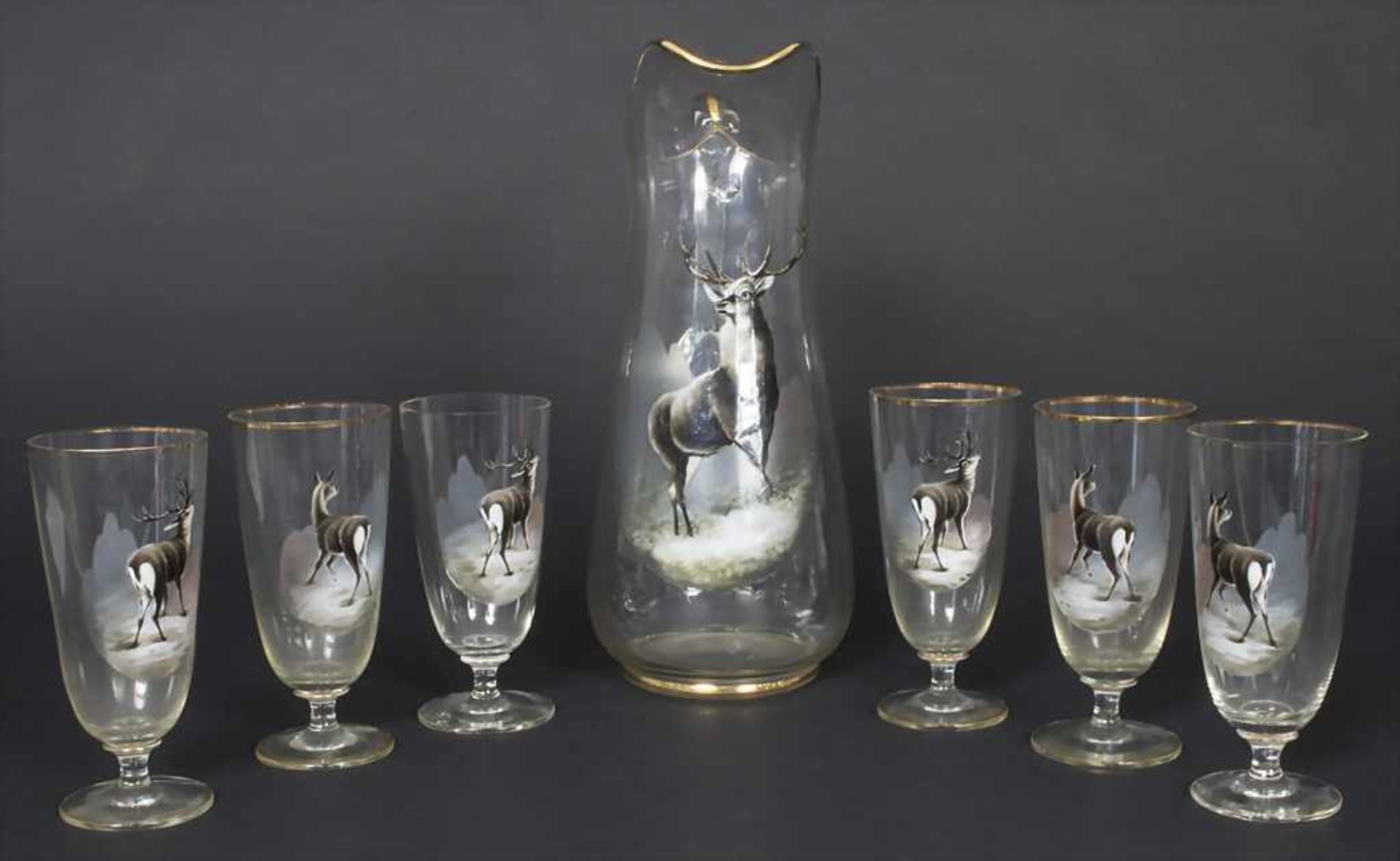 Saftkrug und 6 Gläser mit Hirschmotiven / A decanter and 6 glasses with deer decor, um 1900Material: