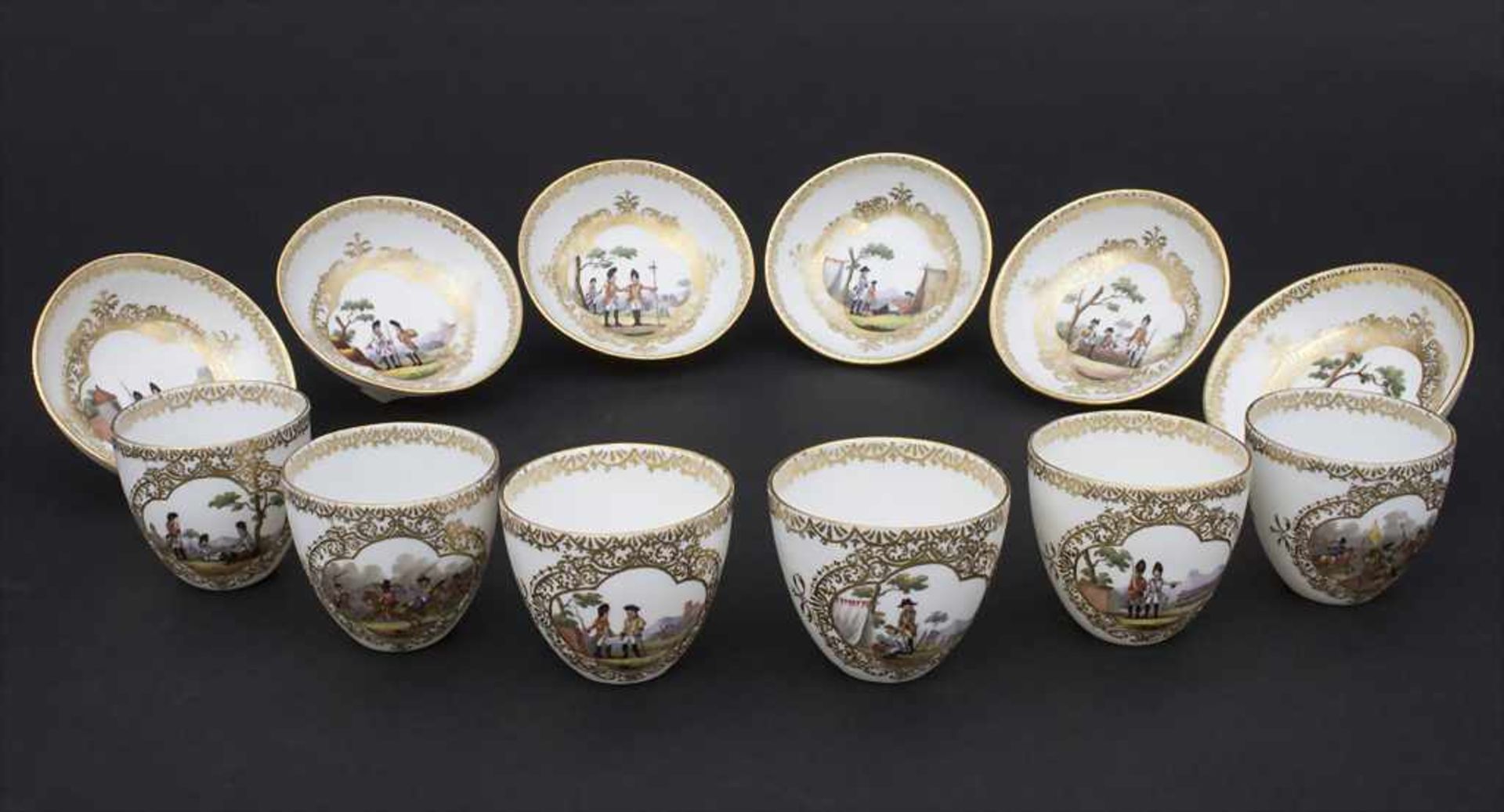 6 Tassen und Untertassen mit Soldaten- u. Schlachtenszenen / 6 cups and saucers with military scenes