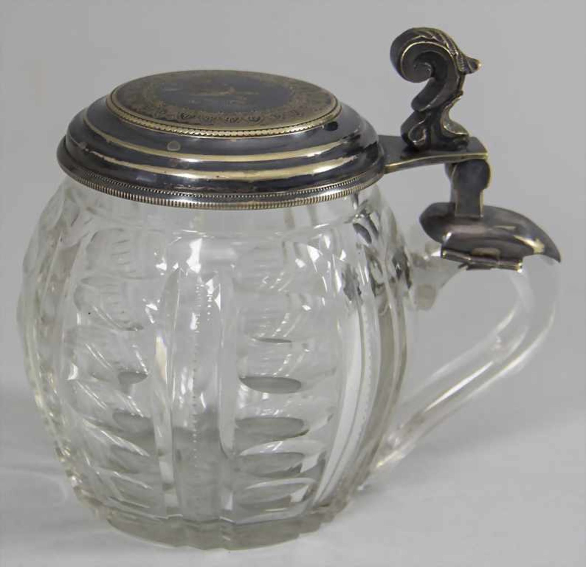Bierkrug / A glass beer mug with plated lid