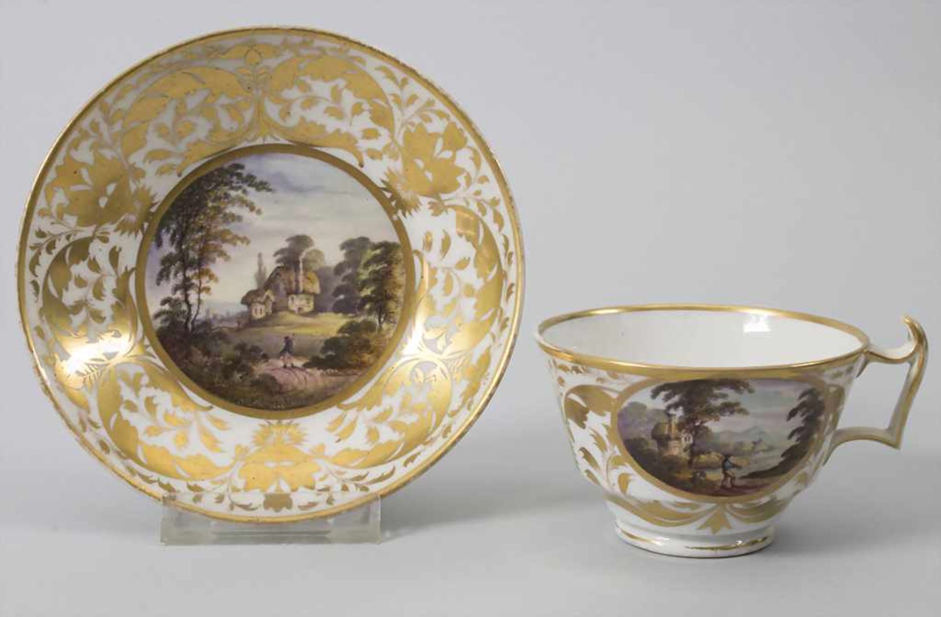 Tasse und Untertasse mit Landschaftsmalerei / A cup and saucer with landscapes, creamware, wohl