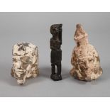 Drei Teile Ägyptenzwei Pharaonenköpfe, 20. Jh., Steinguss, Witterungsspuren, H ca. 14 und 9,5 cm,