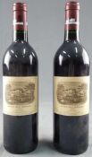 1992 Chateau Lafite Rothschild. 1er Grand Cru Classé. 2 whole bottles.<