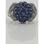 Ring set with 23 sapphires and diamonds.