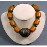 Amber necklace with metal main ball and green glass spacers