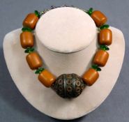 Amber necklace with metal main ball and green glass spacers