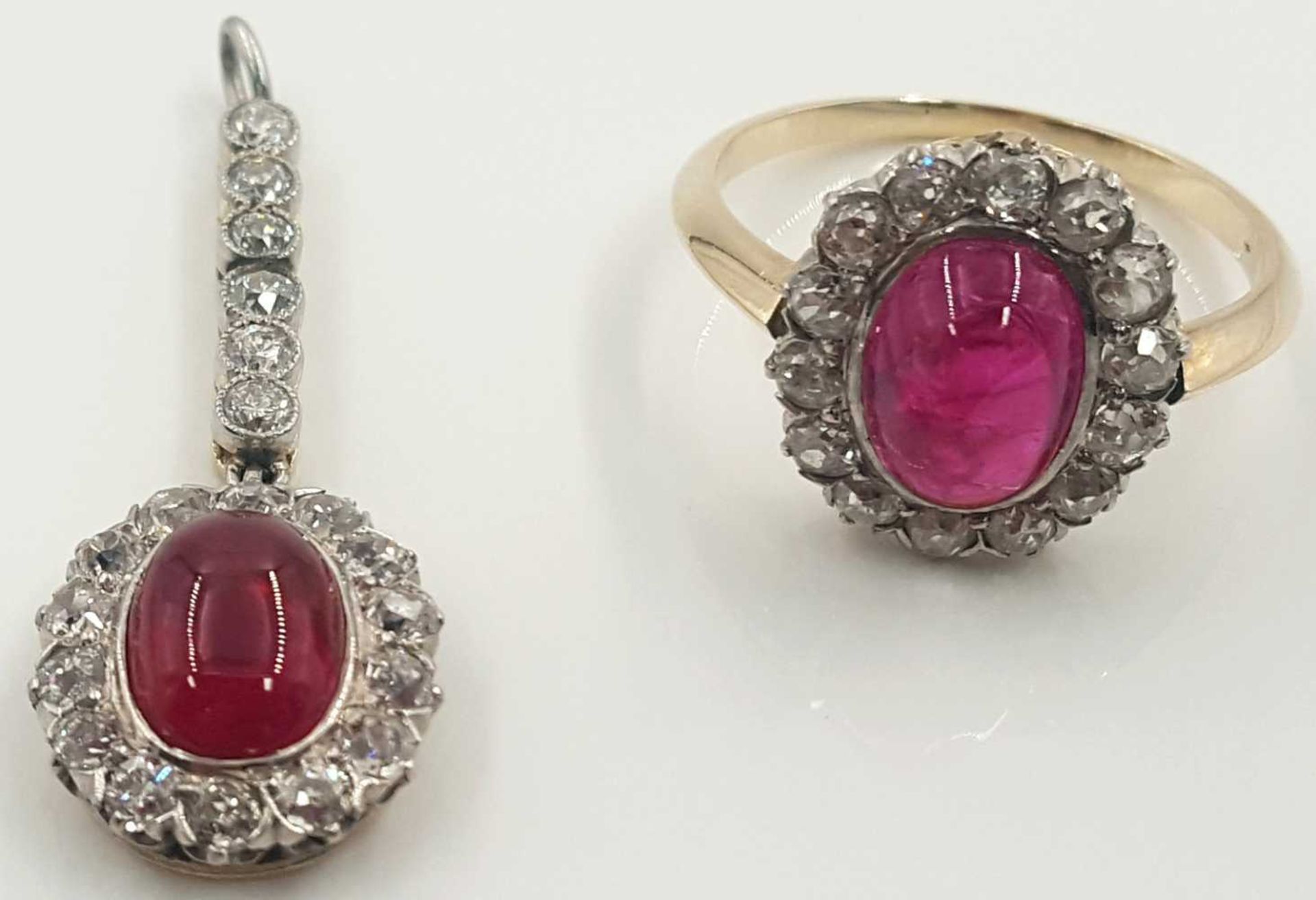 Set. Ring with ruby (Burma) and 14 diamonds.