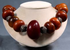 Amber necklace. Proably Africa. Blood colored center stone circa 55 mm.