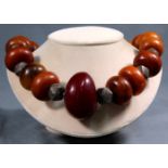 Amber necklace. Proably Africa. Blood colored center stone circa 55 mm.