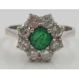 Ring, white gold 585, with central emerald and 8 diamonds.