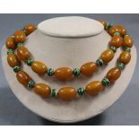 Amber necklace with additional green balls.