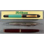 Montblanc mechanical pencil, Montblanc fountain pen and a Pelikan fountain pen.