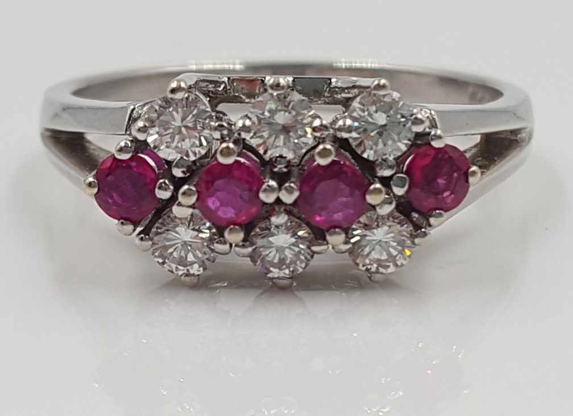 585 white gold ring, with 6 diamonds and 4 rubies.