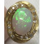 585 yellow gold ring set with Opal and Diamonds.