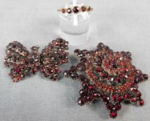 Garnet jewelry. Breast star, Papillon brooch, ring.The breast star 49 mm in diameter. Historical