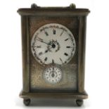 Travel alarm clock. Dresden 1903.10 cm x 7 cm x 5 cm. Measured with the hanger folded down. Brass