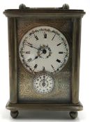 Travel alarm clock. Dresden 1903.10 cm x 7 cm x 5 cm. Measured with the hanger folded down. Brass