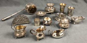 Silver. Also a trowel, vases, cups, tea strainer on stand, sugar bowl.At least 1720 grams of