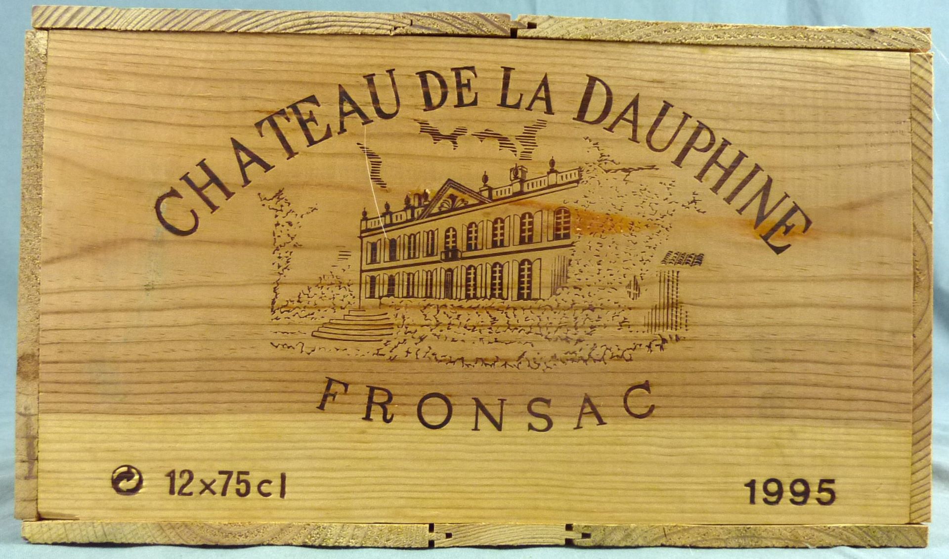 1995 Chateau de la Dauphine, Fronsac, France12 whole bottles. 12.5% Vol. 75 cl. OWC unopened. Mis